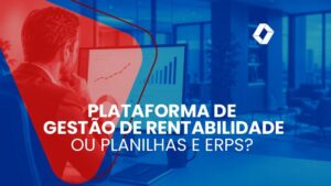 Executivo analisando gráficos financeiros em uma tela de computador em escritório